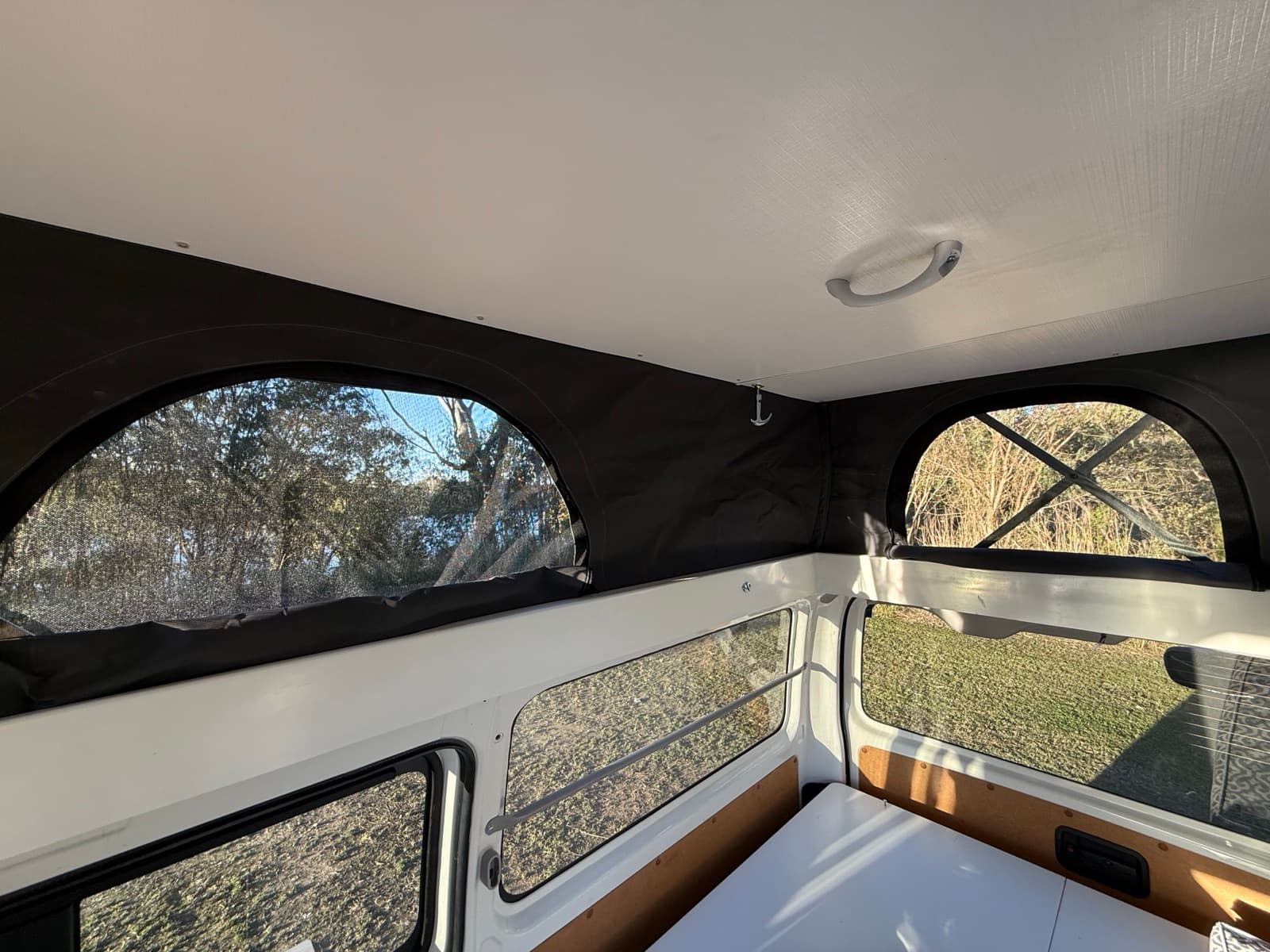 Interior view showing standing room with pop top raised