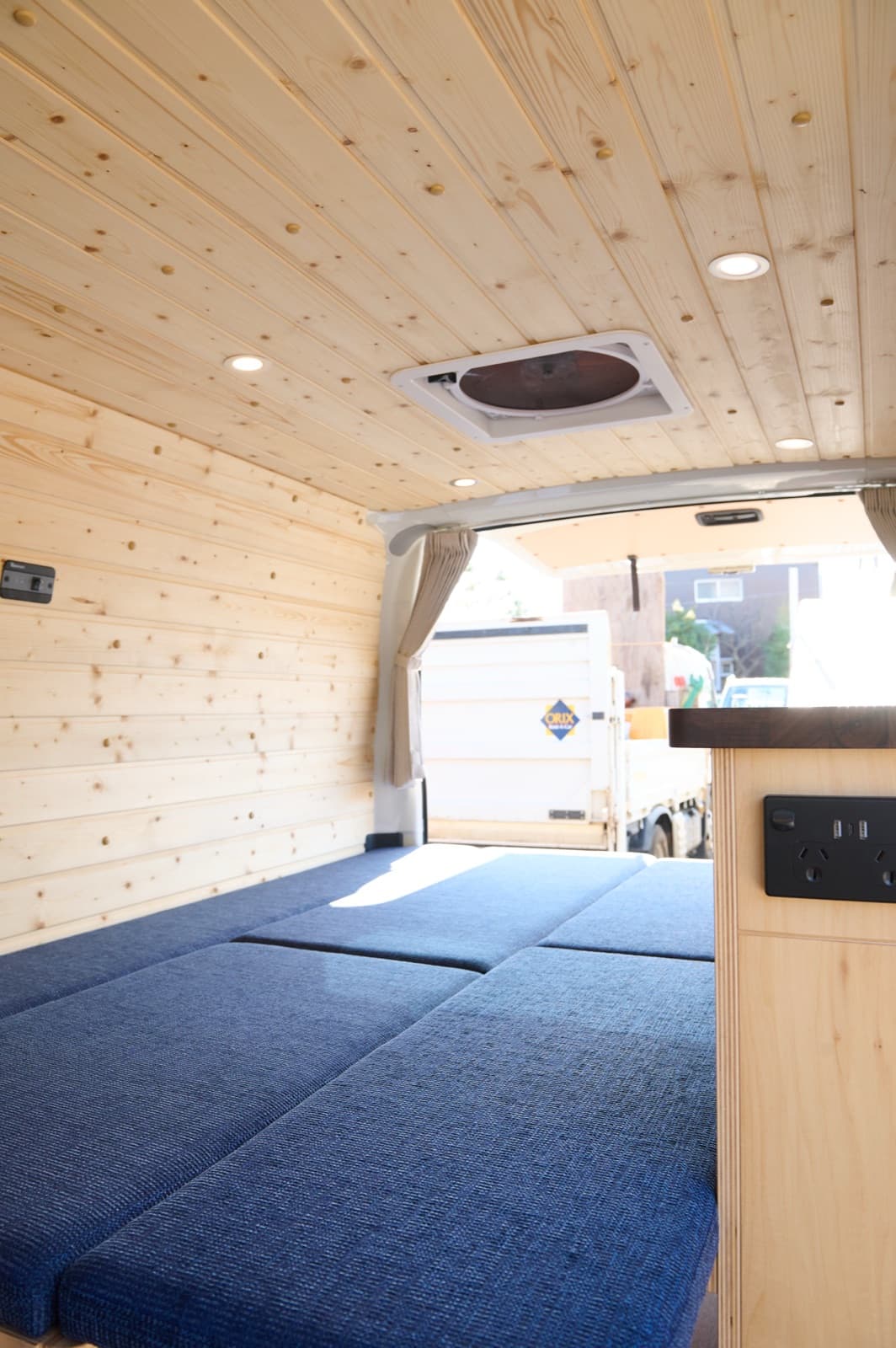 TAMA bed laid out with timber ceiling